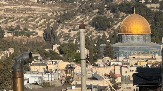 A tall metal pole with a dome on top