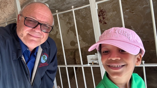 A person and a child posing for a picture