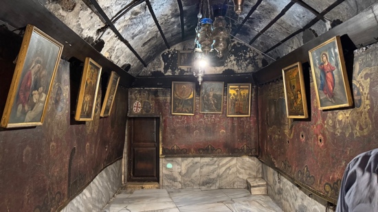 A room with paintings on the walls