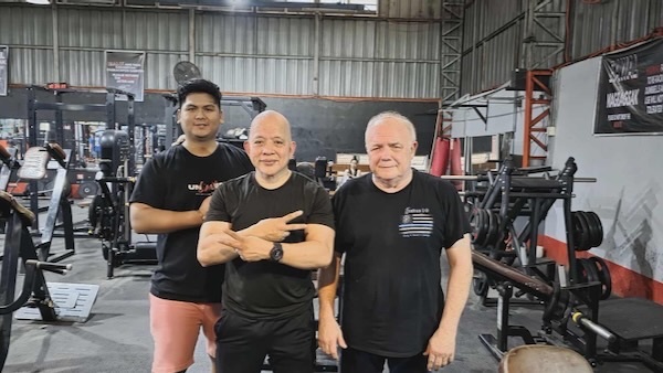 A group of men posing for a picture