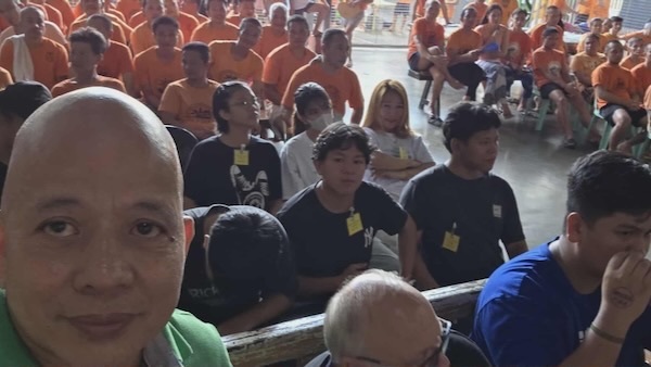 A group of people sitting in a room