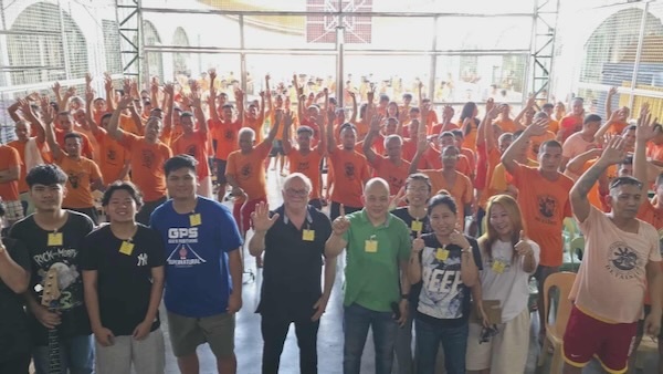 A group of people standing in a room