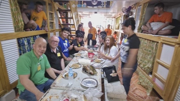 A group of people sitting at a table