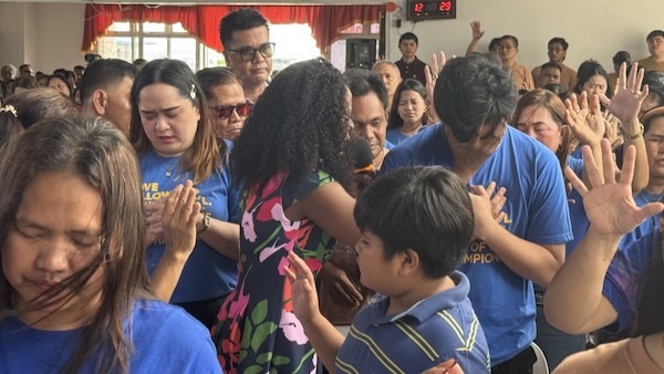 A group of people standing in a circle