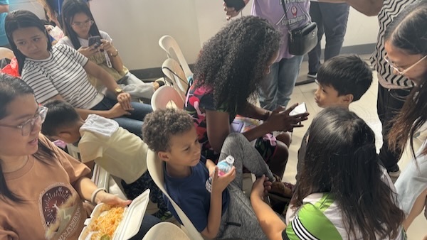 A group of people sitting in chairs
