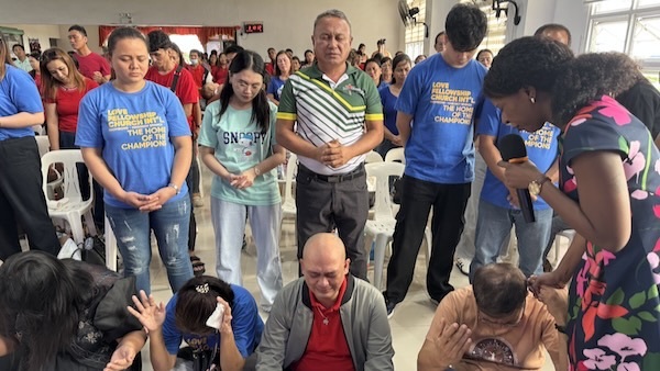 A group of people standing in a circle