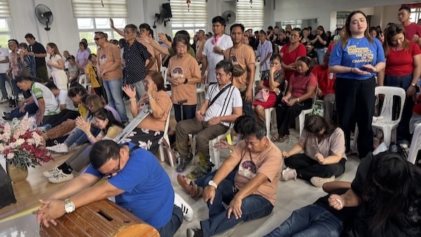 A group of people sitting on the floor
