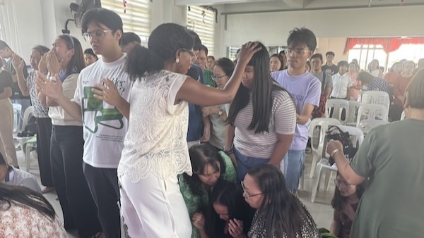 A group of people standing in a room