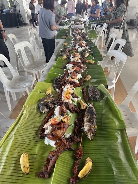 A long table with food on it
