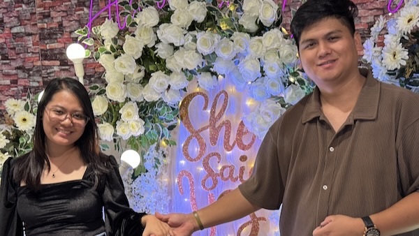 A person and person holding hands