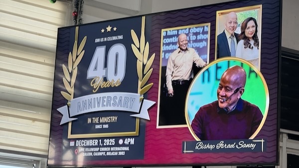 A sign with a picture of two people