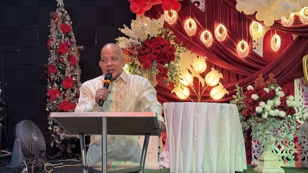 A person speaking into a microphone