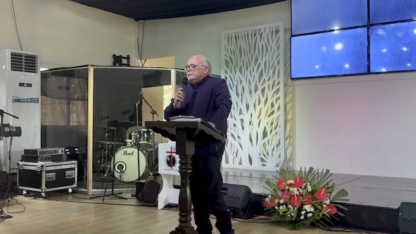 A person standing at a podium