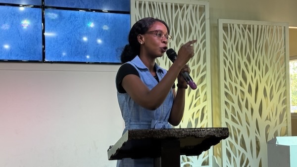 A person speaking into a microphone