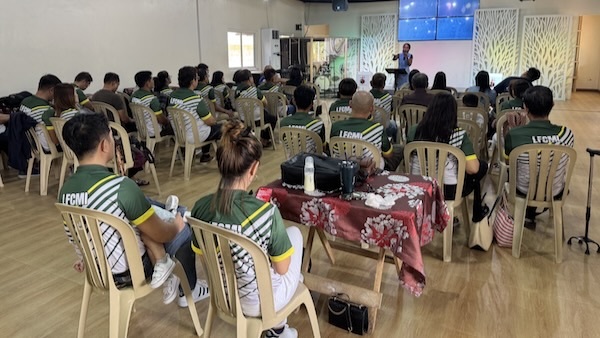 A group of people sitting in chairs
