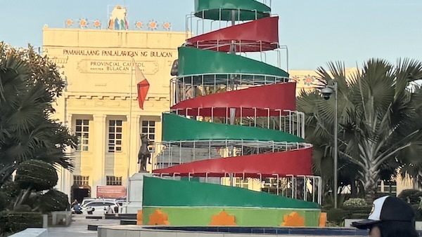 A spiral staircase in front of a building
