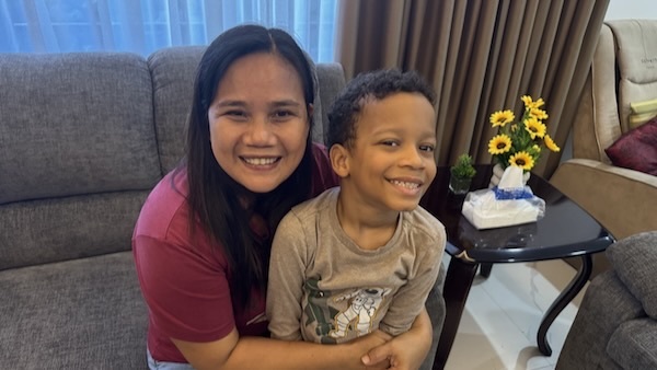 A person and a child smiling