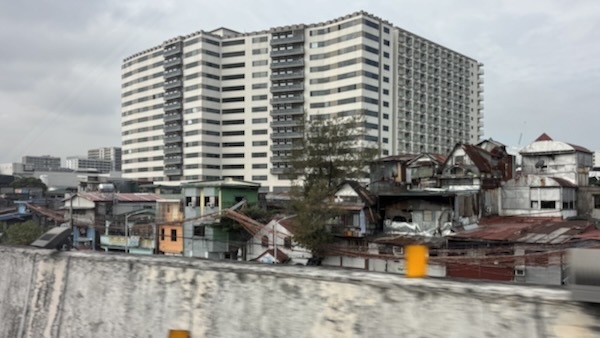 A building with many houses in the background