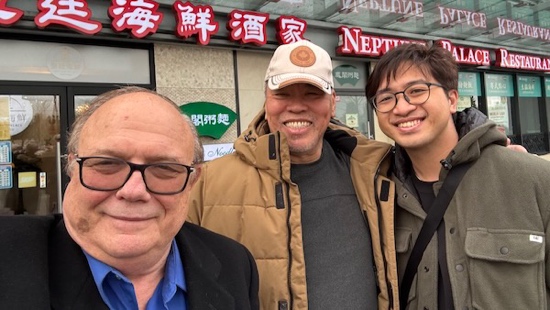 A group of men standing together outside a building