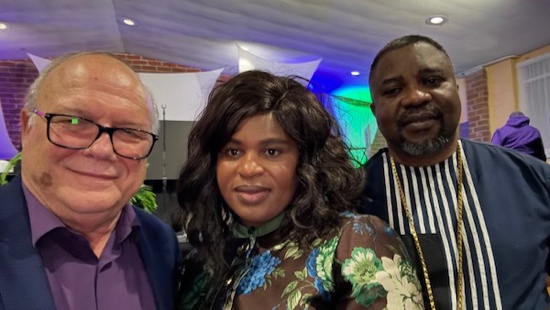 A group of people posing for a photo

Description automatically generated