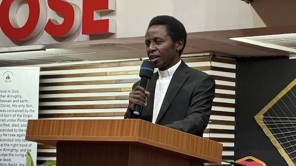 A person speaking into a microphone