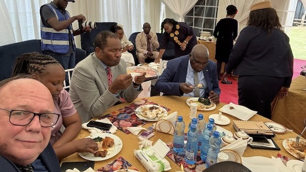A group of people eating at a table