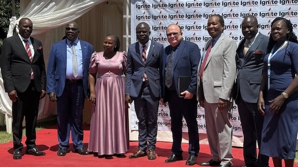 A group of people standing on a red carpet