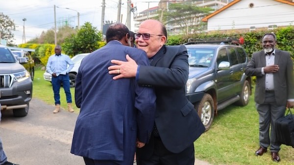 A person hugging another person