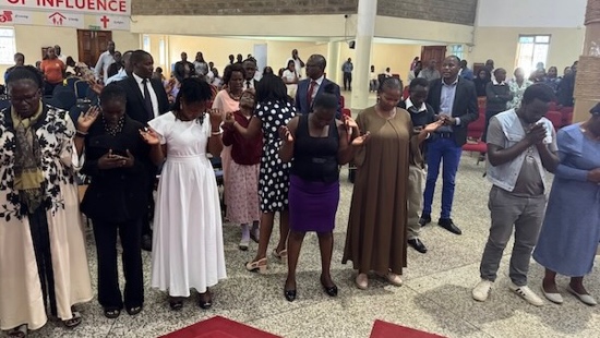 A group of people standing in a circle