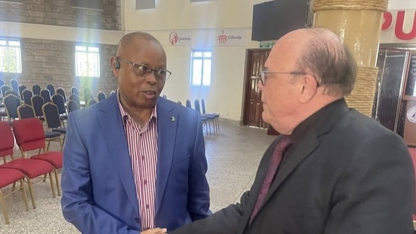 Two men in suits talking