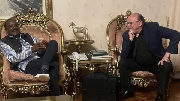 Two men sitting in chairs