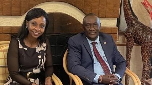A person and person sitting in chairs