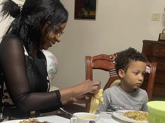 A person and a child eating at a table