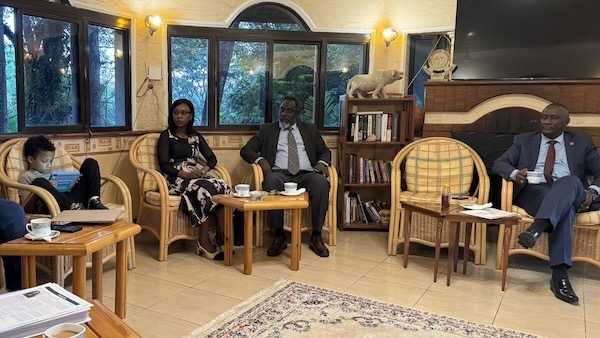 A person and person sitting in chairs