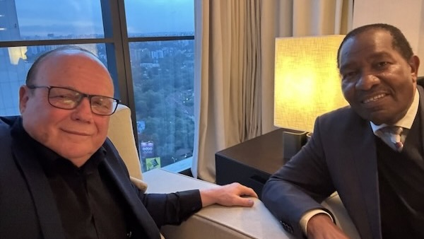 Two men sitting in a room