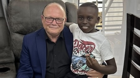 A person and child posing for a picture