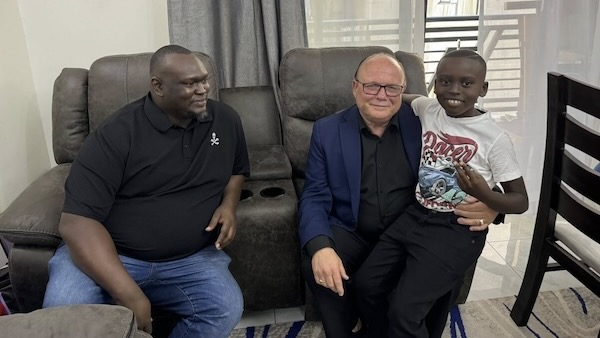 A group of men sitting on a couch