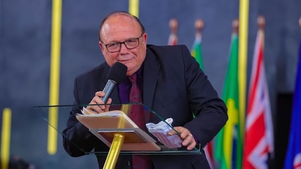 A person speaking into a microphone