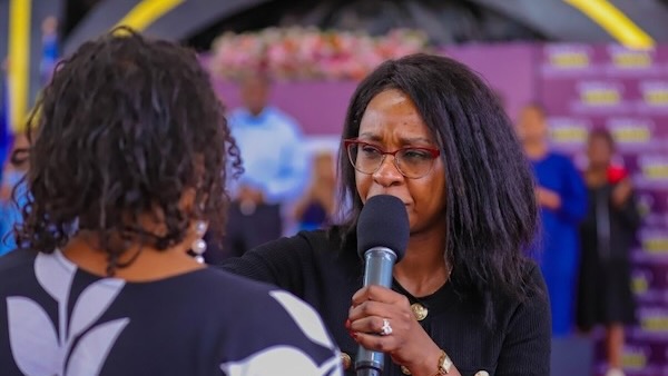 A person speaking into a microphone