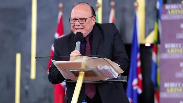 A person speaking into a microphone