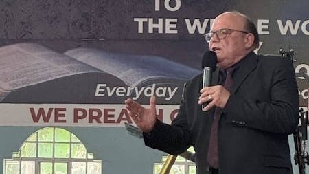 A person speaking into a microphone