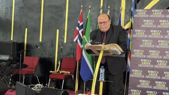 A person standing at a podium