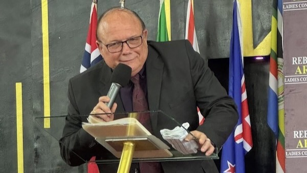 A person speaking into a microphone