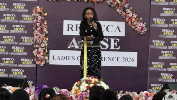 A person standing on a podium with a microphone