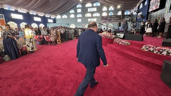A person walking on a red carpet