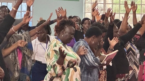 A group of people raising their hands