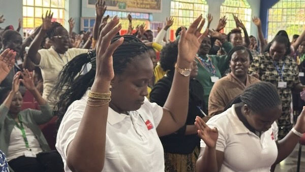 A group of people raising their hands