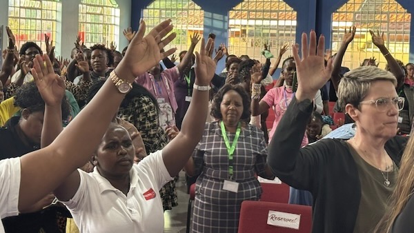 A group of people raising their hands
