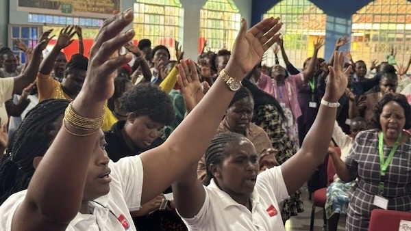 A group of people raising their hands