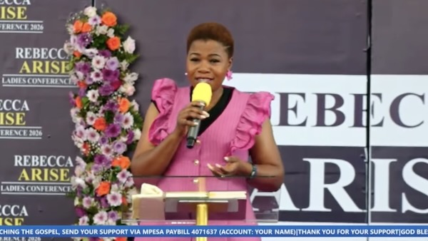 A person speaking into a microphone